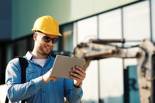 Construction engineer using digital tablet to learn in SAP Litmos