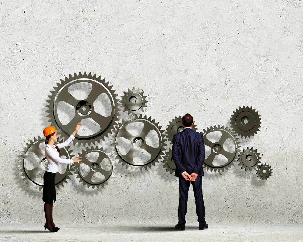 Businessman and businesswoman with cog wheel elements. Organization concept